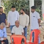 Free health check-up camp organized by local health authorities focusing on community well-being and preventive medicine in rural areas.