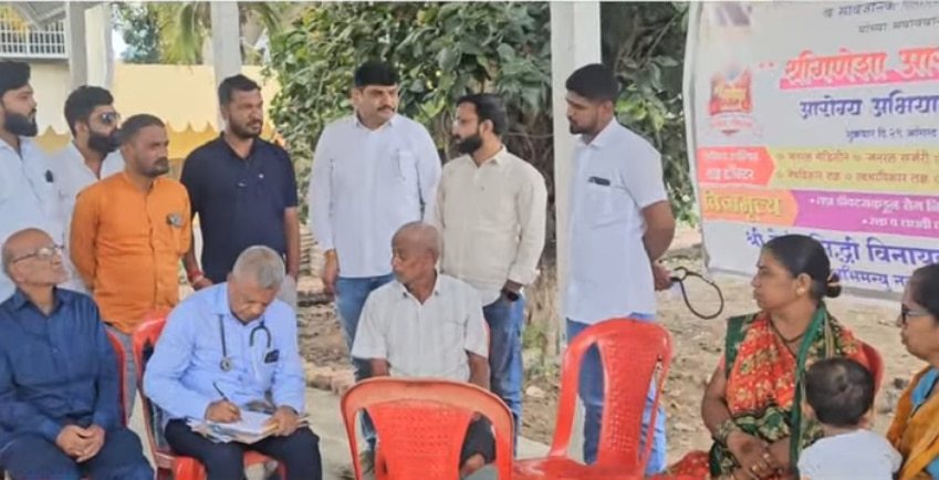 Free health check-up camp organized by local health authorities focusing on community well-being and preventive medicine in rural areas.